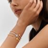 4D2AA51C-9E53-DC2E-17DF-CB9792EAD196_2745b9f9-c676-4ce3-ba4a-cc1074aed6ea.jpg Idylle Blossom Twist Bracelet, Yellow Gold And Diamonds