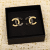 CCE444 CC Black enamel gold embossed stud earrings