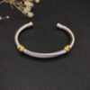 80E32367-3A9A-136B-ADDC-E5E4D74ED683.jpg David Yurman 5mm 18k Gold and Sterling Silver Diamond Station Cable Bracelet