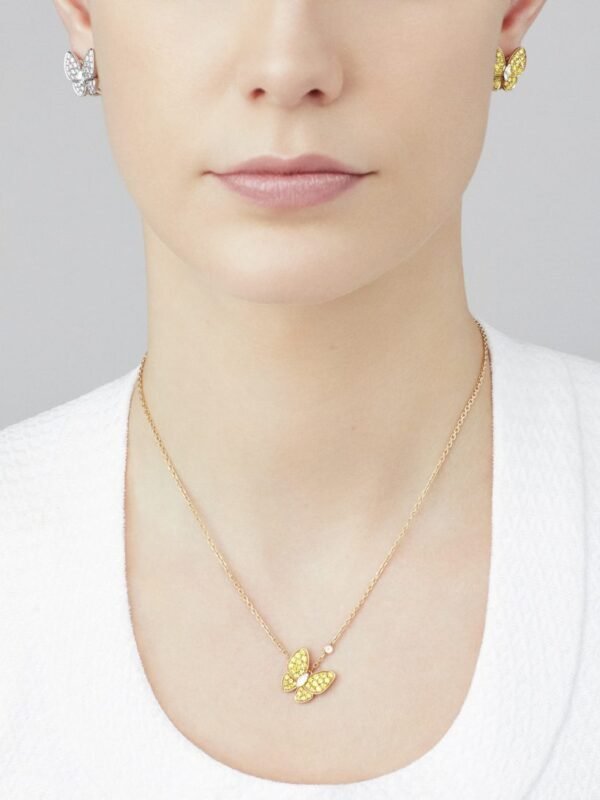 82C6CBF8-A9C0-5D81-BCCE-0A513BD0B3DA.jpg Two Butterfly pendant