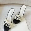 D22E2928-DEBD-E727-EF9A-D715B58885AA.jpg Chanel White/Black Ruffled Fabric CC Bow Slide Sandals