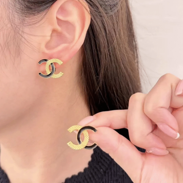 CCE444 CC Black enamel gold embossed stud earrings