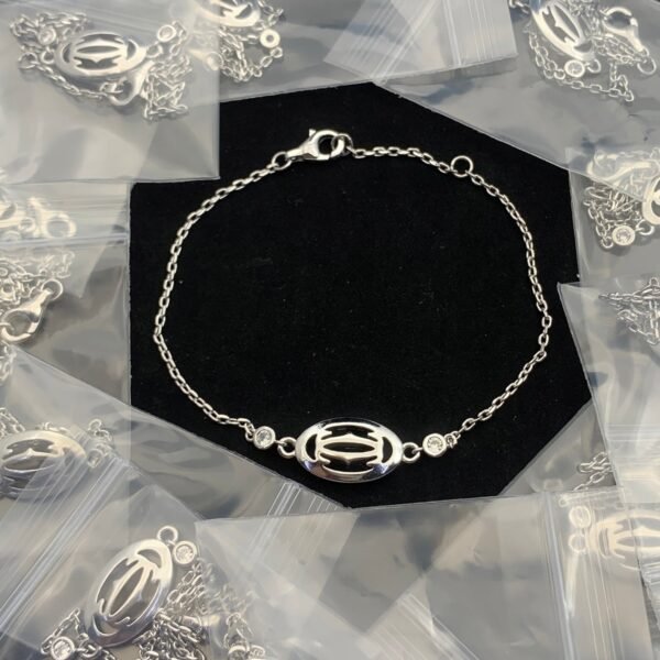 DOUBLE C DE CARTIER LOGO BRACELET - 18CT SILVER